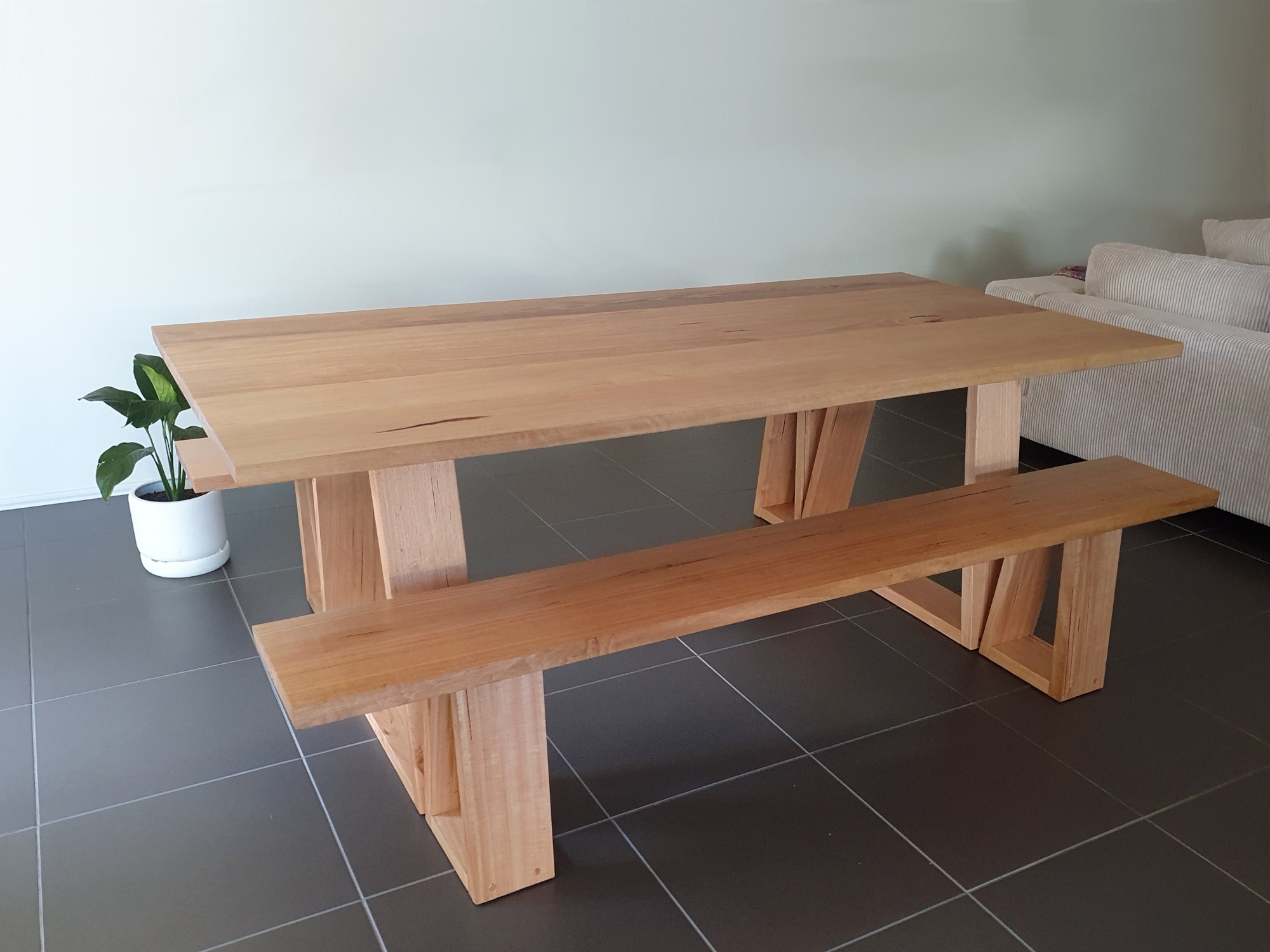 Dining table with angled legs.